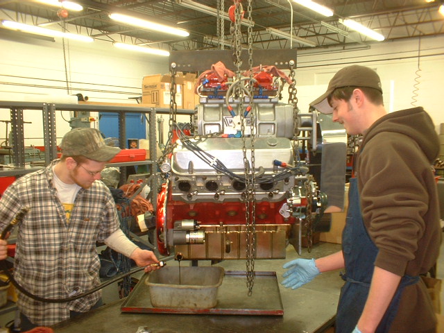 Draining and inspecting the condition of the engines oil